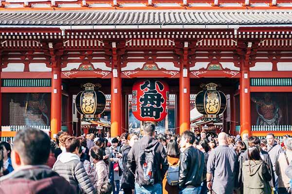Visitors walking around the temple and enjoying the Shinto shrine.