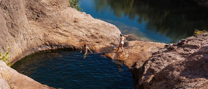 Surprise Creek Falls is located in Litchfield National Park. From the carpark, it’s a short walk-through monsoonal forests to find a large pool, but the surprise is when you climb up the rocks to find the hidden pools above.
