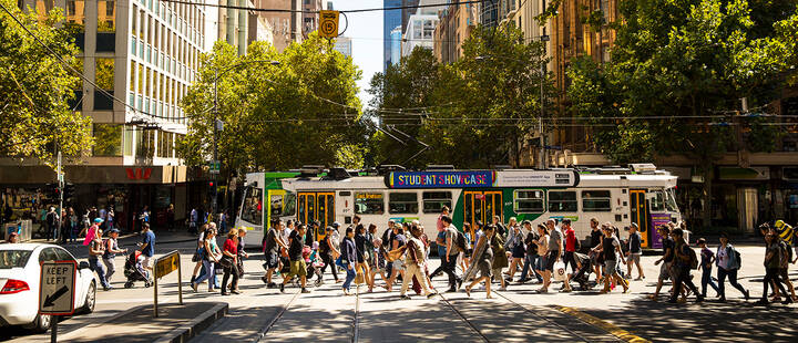 Streetscape of Melbourne tram and pedestrians at Collins Street and Swanston Street Intersection 