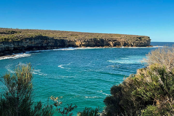 Beautiful view from above at Wattamolla, from the coastal walking trail to Providence Point in Royal National Park, located South of Sydney, NSW, Australia.