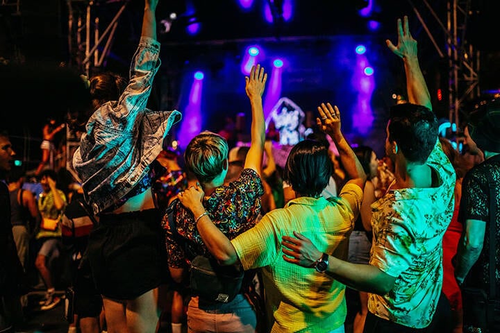 Friends dancing at the Oxford Street Party in Darlinghurst, Sydney