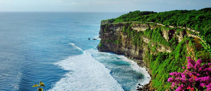 View of Uluwatu cliff with pavilion and blue sea in Bali, Indonesia