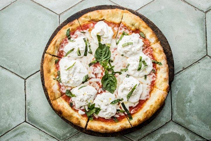 Freshly served pizza at La Baracca Restaurant Uluwatu, Bali