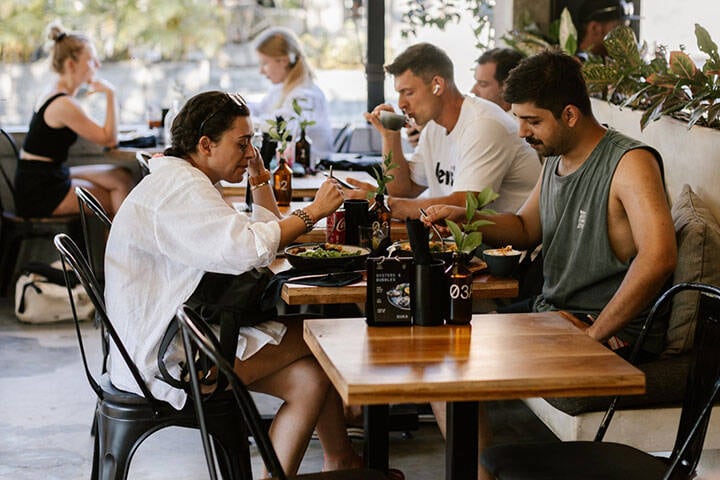 Diners eating lunch inside at Suka Espresso Cafe, Bali