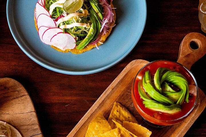 Flat lay of breakfast spread at La Pasion Cafe in Uluwatu, Bali
